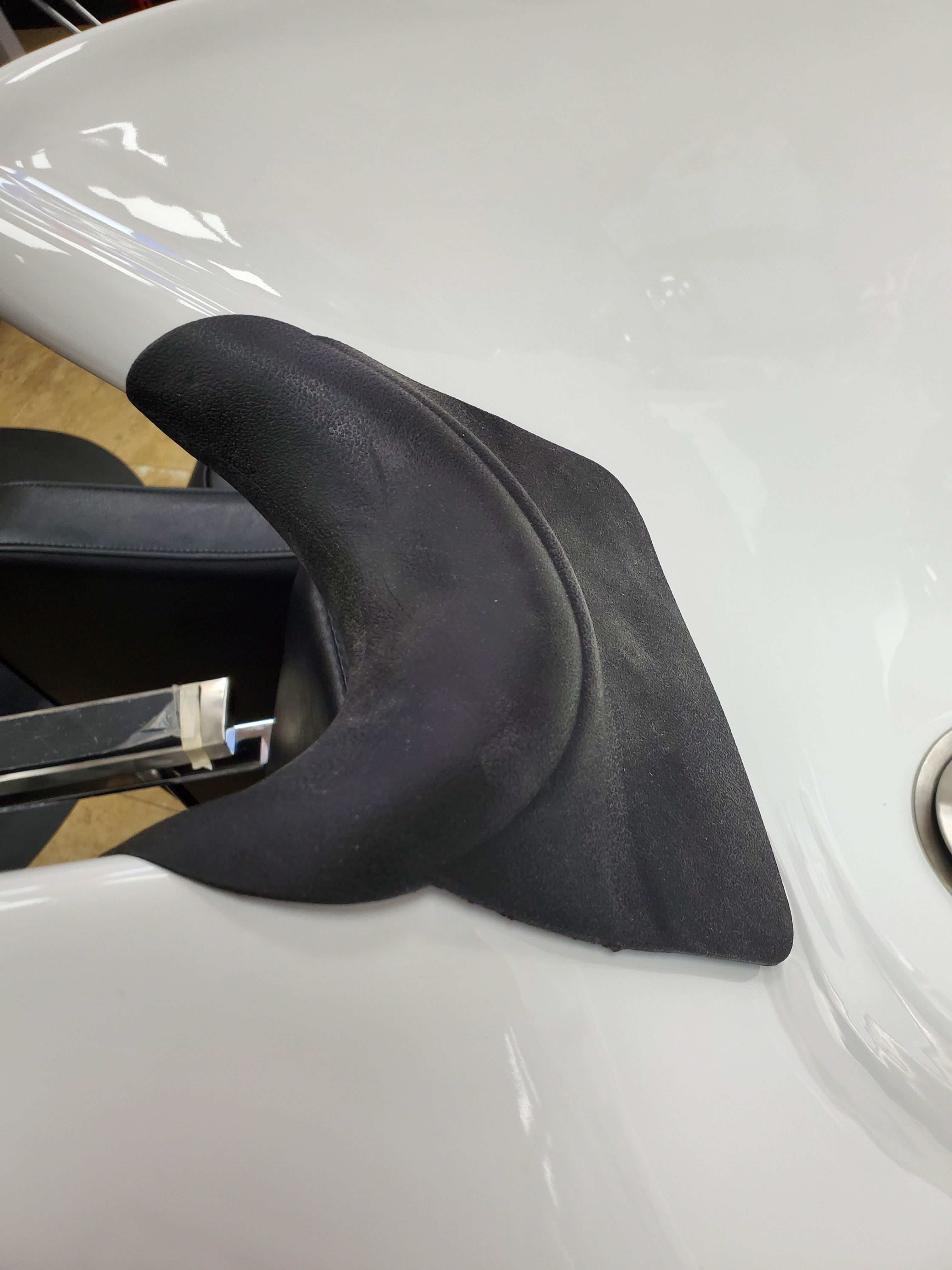 Silicone neck for shampoo unit.