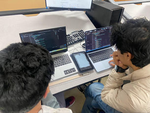 Programming teams hard at work to finish coding the robot with looming Knight Krawler competition