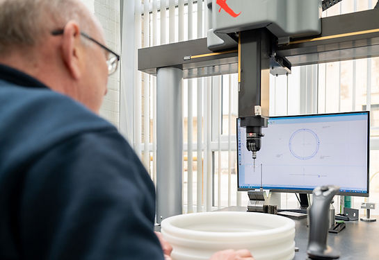 John measures a component on the CMM machine