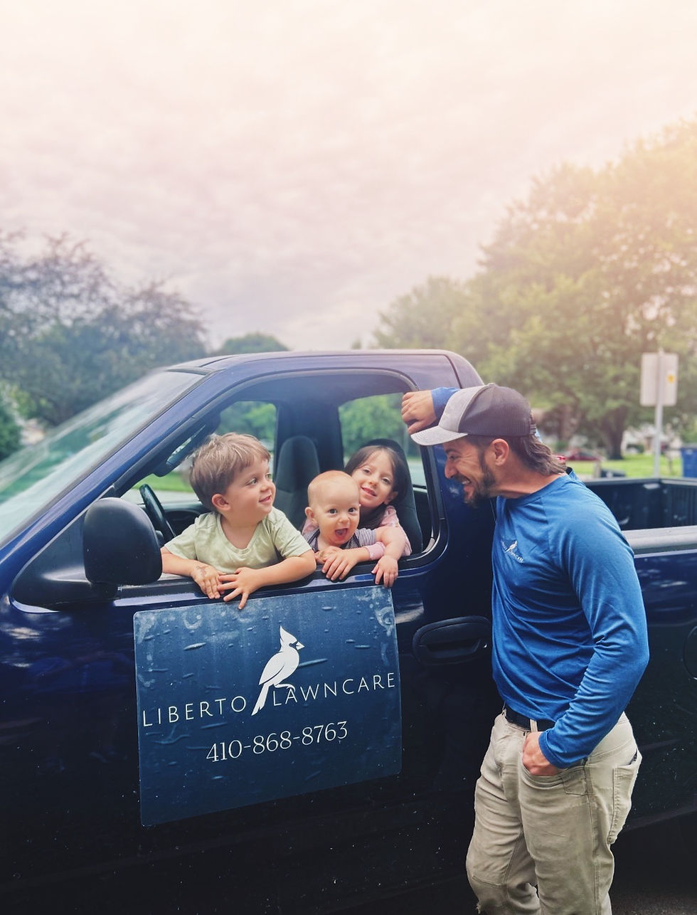 Eldersburg local landscape company team and kids in truck