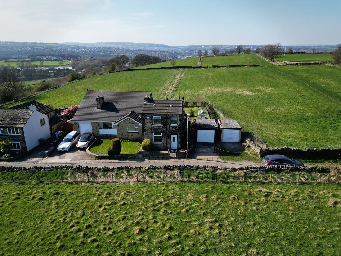 Drone shot of a property surrounded by fields