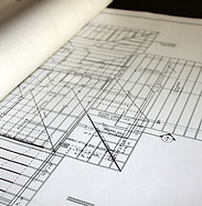 Blueprints of electrical plans On Desk