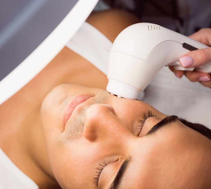 doctor-performing-laser-hair-removal-patient-face.jpg