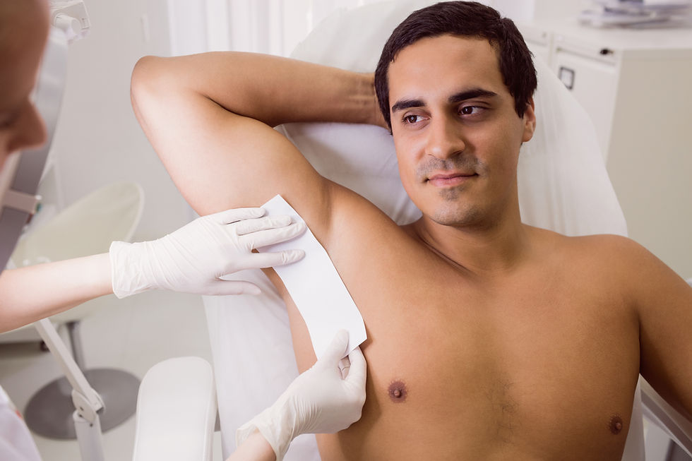 doctor-waxing-male-patient-skin.jpg