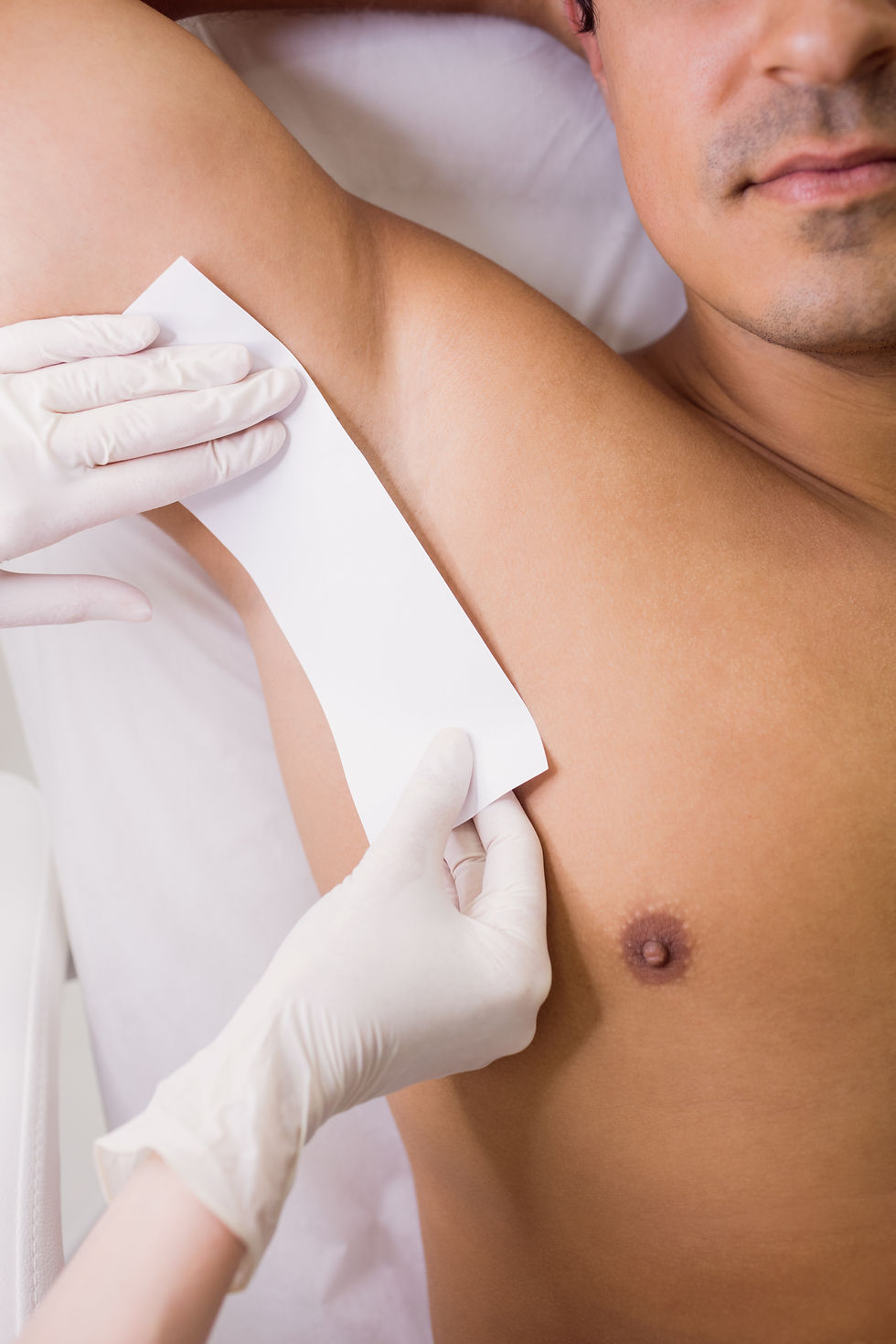 doctor-waxing-male-patient-skin-clinic.jpg
