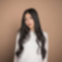This is a professional portrait of Nightingale (she/her). She in Vietnamese, has long black hair and wearing a white blouse.