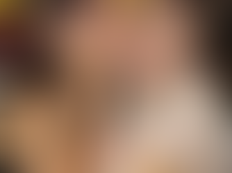 A daughter kissing her mother on the cheek. Both women embracing each other.