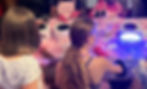Children at a mobile press on nail party using UV lamps.