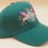 Thumbnail: Cat's Eye Forest Green Hat with Embroidered Cat with wings, crystal, eye design