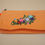 Thumbnail: Front View Orange Embroidered bag with floral vine and clock