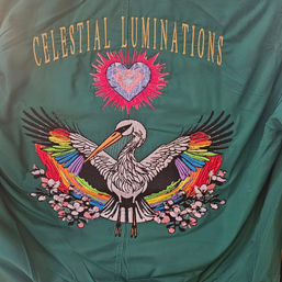 Green Bomber Jacket showcasing embroidered bird with rainbows and crystal heart.