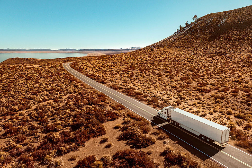 Eye-level view of a truck with its hood open on the roadside