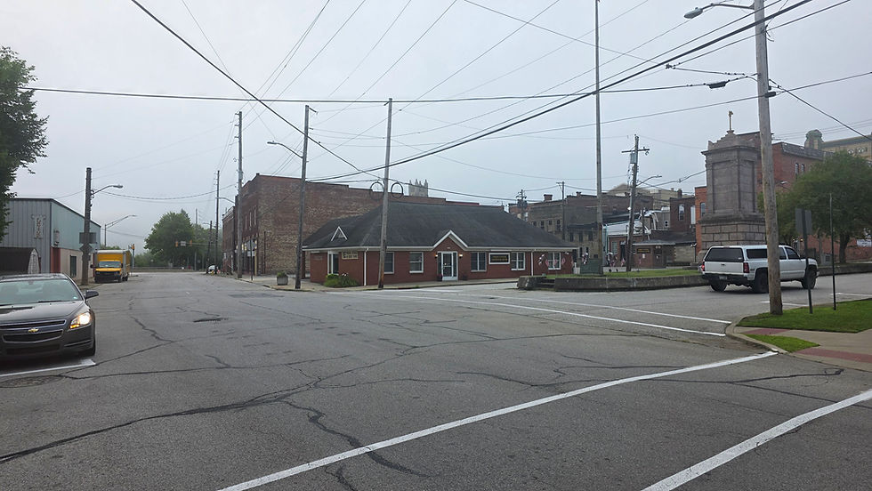 Turn where that white car is going. That's Central Avenue even though it's technically off center.