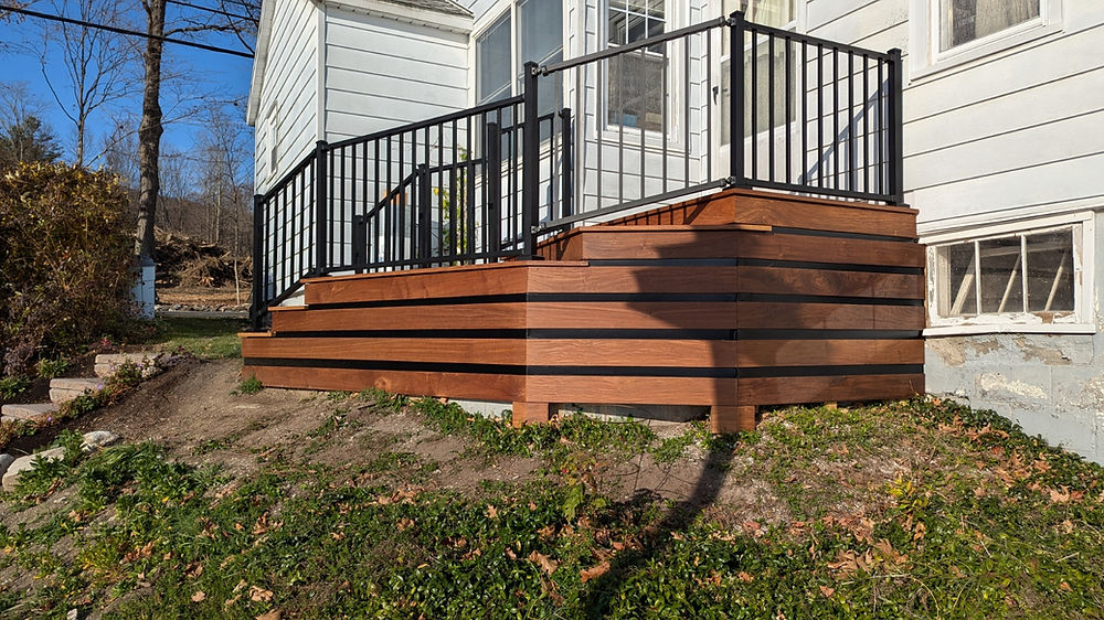 new wood deck with metal railing