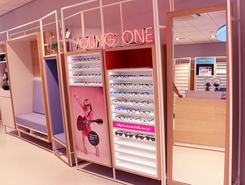 Glass Story optical store concept with pastel interior and eyewear display wall