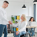 woman-wheelchair-shaking-hand-with-coworker.jpg