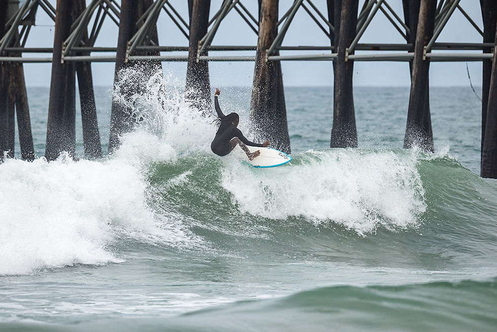 Maizy Gordon enjoying some free surfing in Oceanside on the Southside of the Pier, Local Break Surf Magazine.