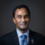 A photograph of Kevin Shaw from the shoulders up wearing a suit and tie.