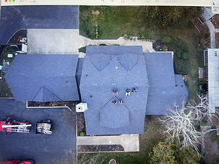 Roof top with roofers drone view