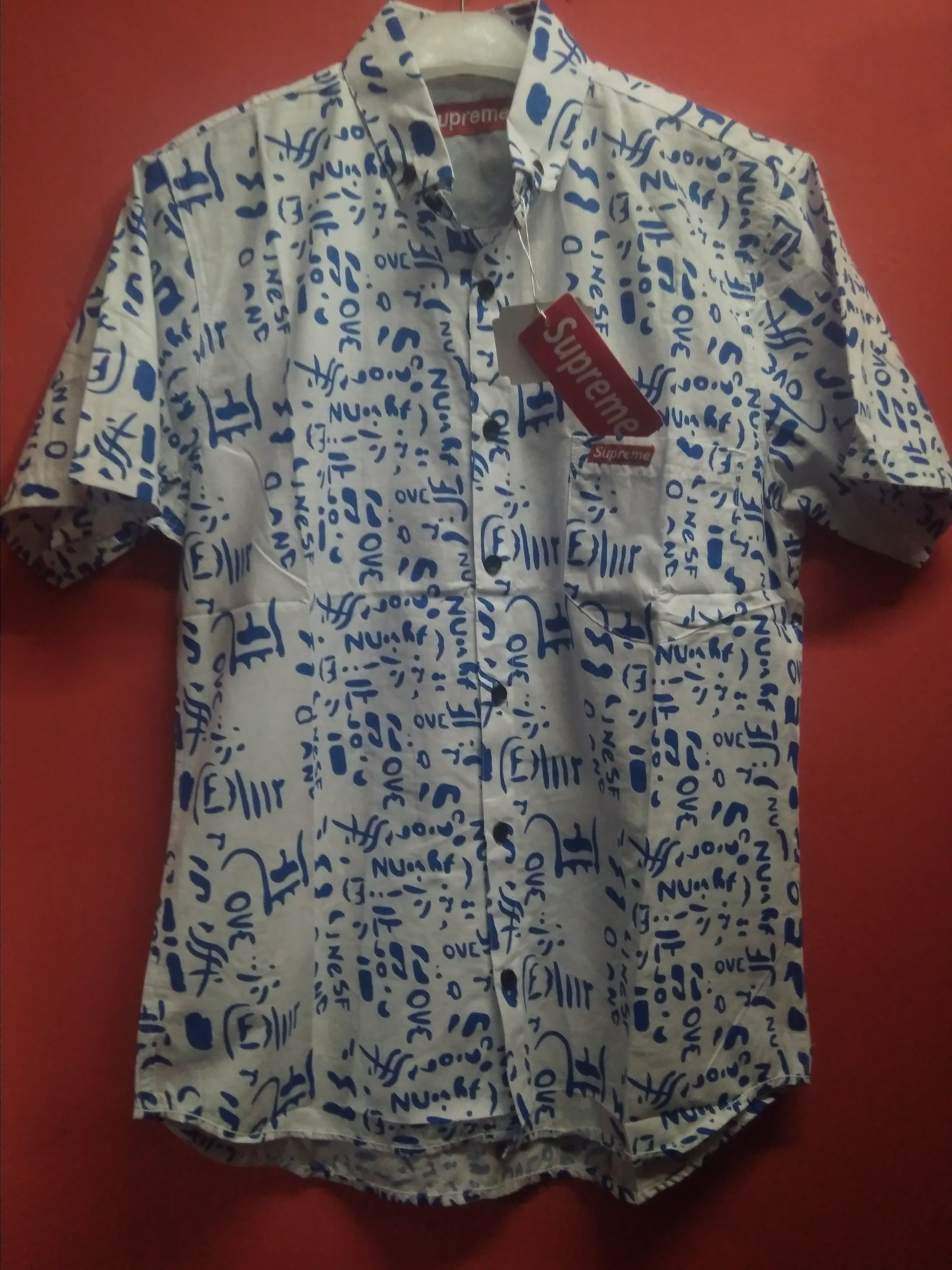 kemeja Supreme motif