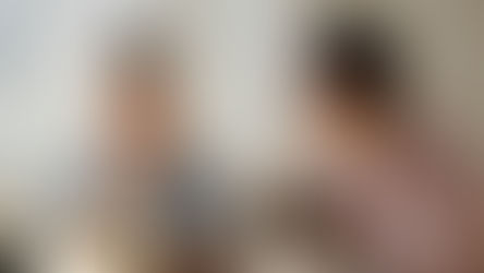 Two women sharing breakfast, one with Down syndrome, fostering togetherness and care.