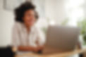 young-black-smiling-woman-working-at-computer-in-a-2022-02-01-22-37-26-utc_edited_edited.j