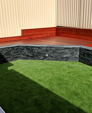 Retaining walls, decking, timber, stone, lighting, artifical grass
