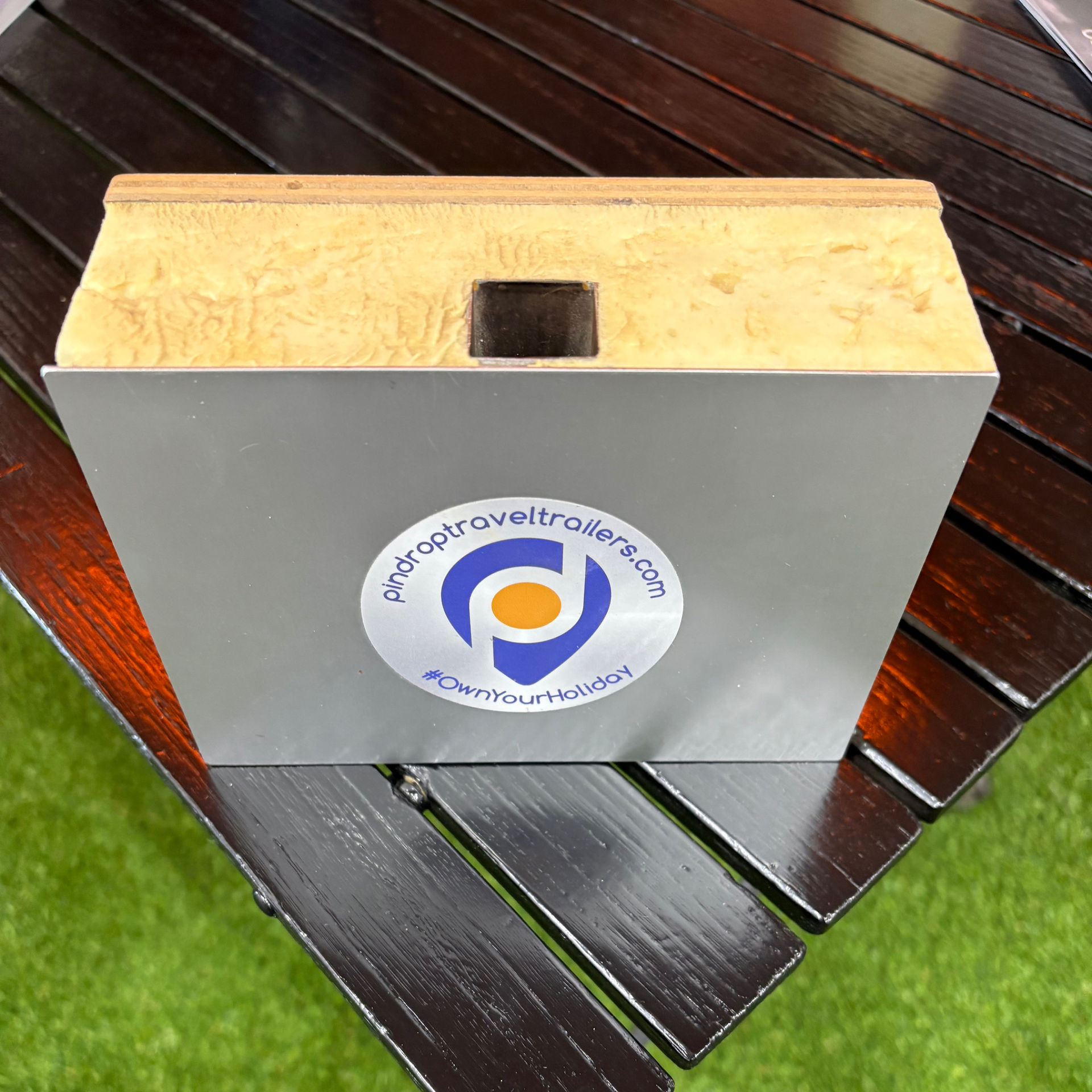 the insulation wall cut out showing interior and exterior walls with insulation foam in the middle.