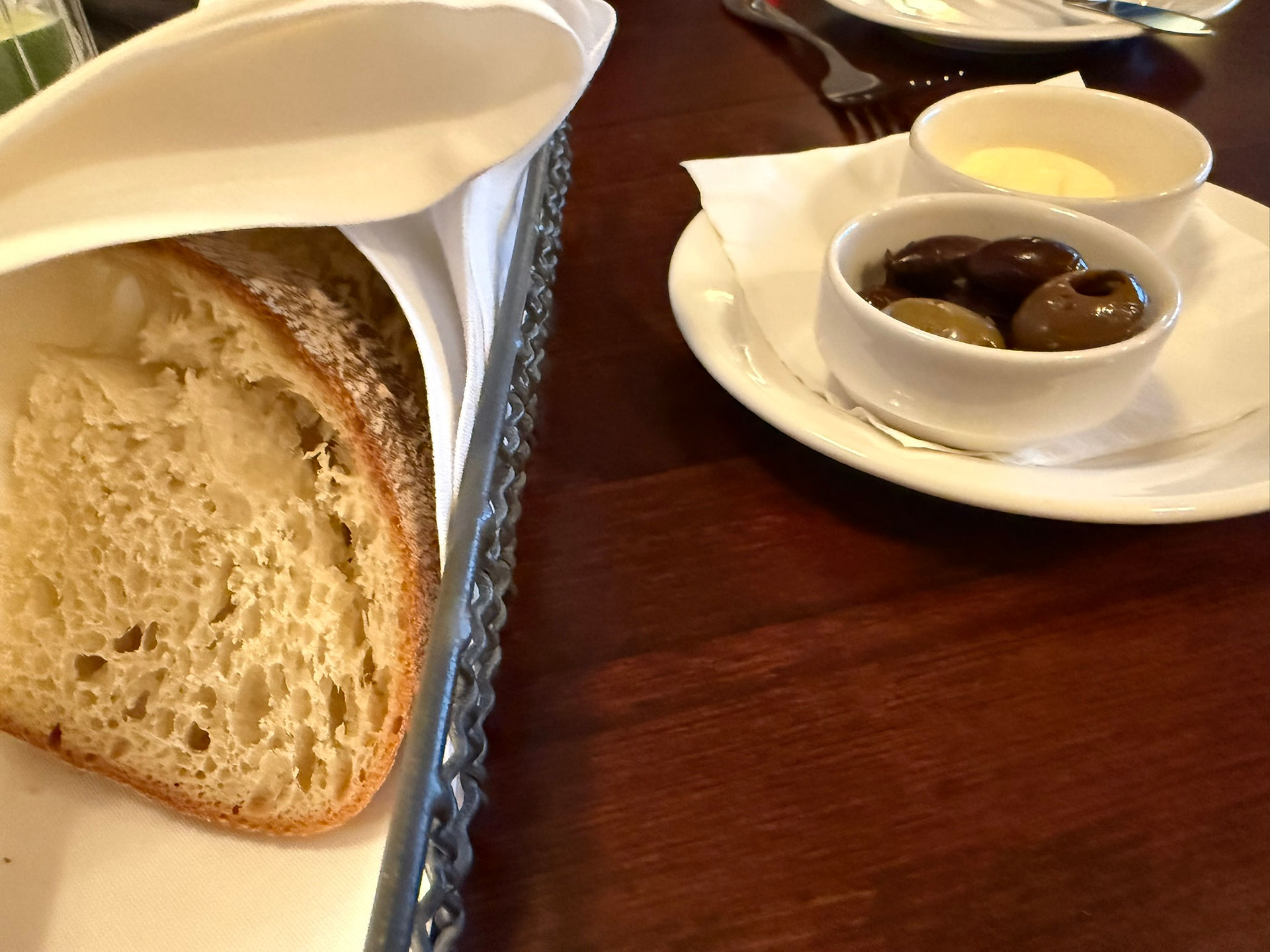 bread, butter, and marinated olives
