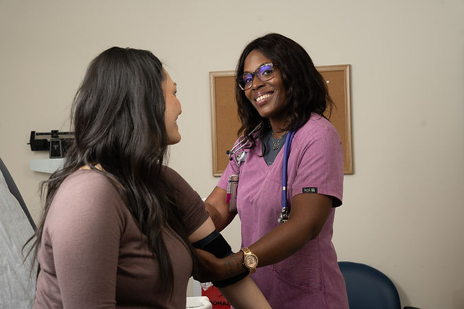 MA taking blood pressure