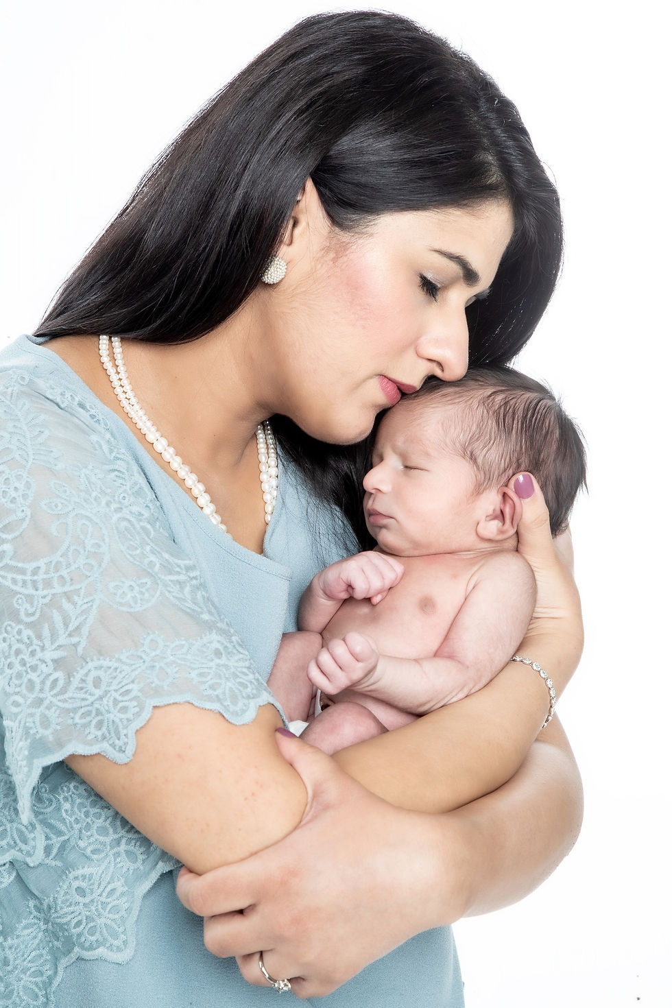 Newborn photography captures beautiful, timeless newborn portraits to remember your baby's first days of life! New York City newborn photographer, Zion Yoni Levy, specializes in stunning images and beautiful portraits of newborns, babies, and families. For newborn photoshoots, we have baby outfits and props needed for the photo shoot to make your vision come to life. You may bring your own outfits in addition to the many props and outfits we have at the studio. The optimal time to shoot newborn portraits is at 7 to 21 days old, but there is plenty of flexibility to get stunning photos of your new baby.