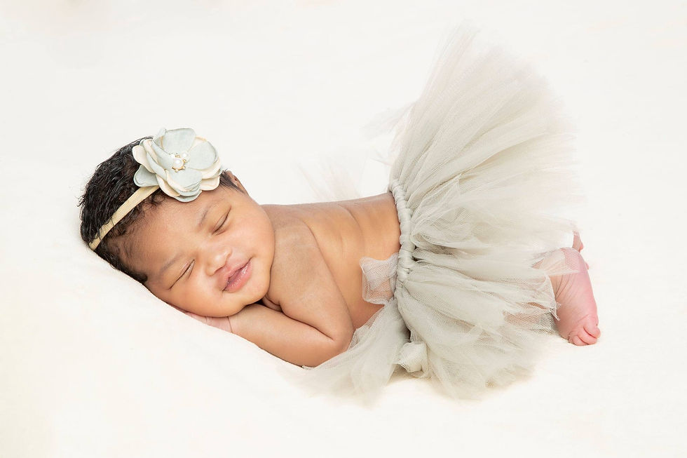 Newborn Photographer at Tals Studio Manhattan Professional Newborn Photoshoot Baby Portrait smiling baby in a tutu dress