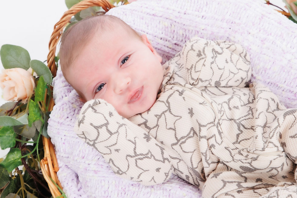 Sleeping newborn swaddled in soft blanket