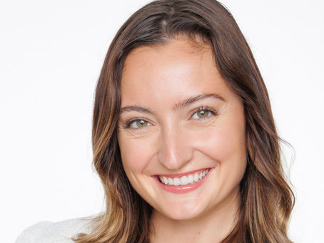 Photographer taking corporate headshot with lighting setup