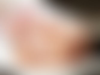 Maternity milk bath session in NYC with blue milk and floral accents at Tals Studio