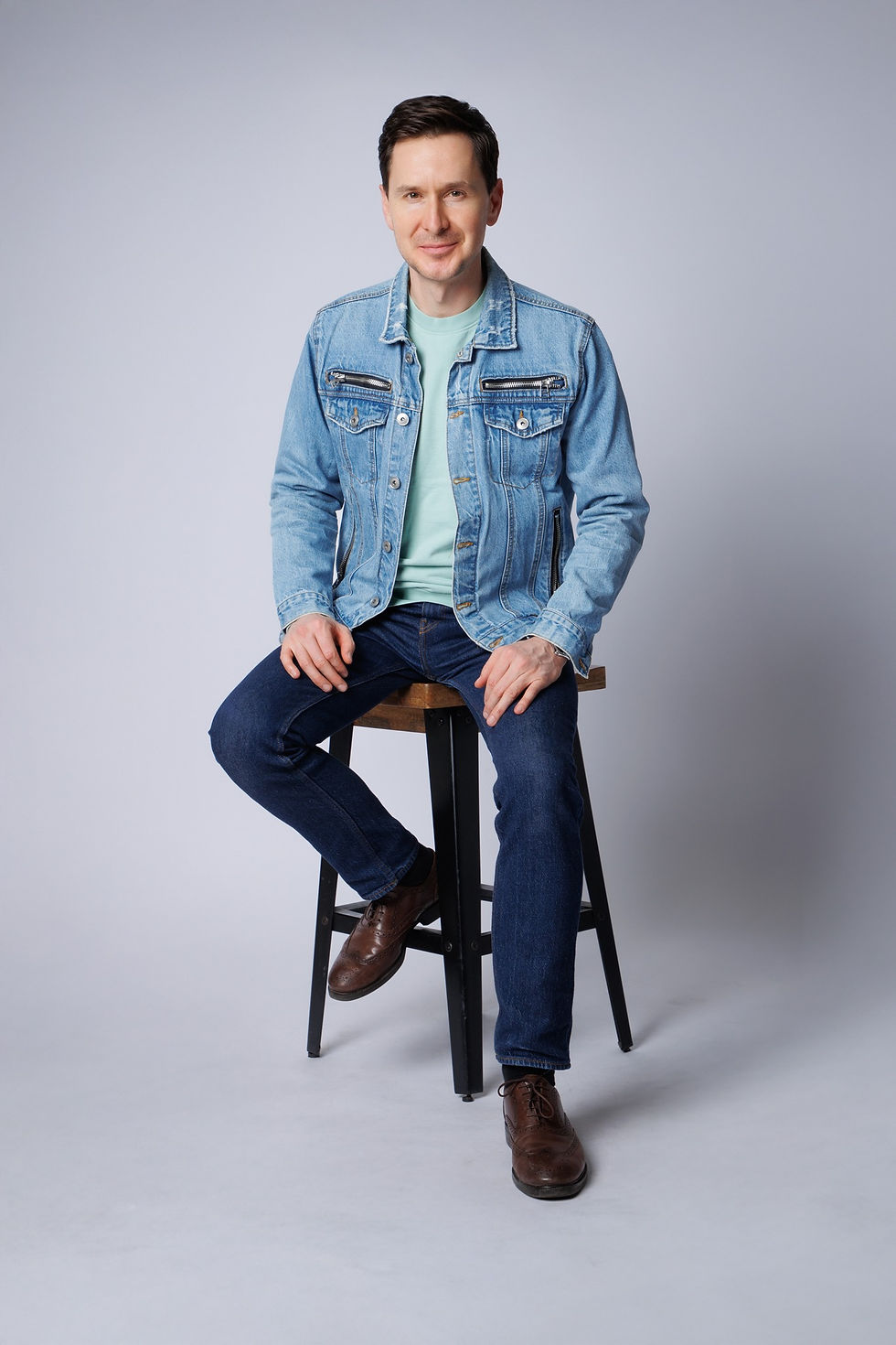 Client during portrait photography session at Tals Studio NYC with soft lighting and guided posing