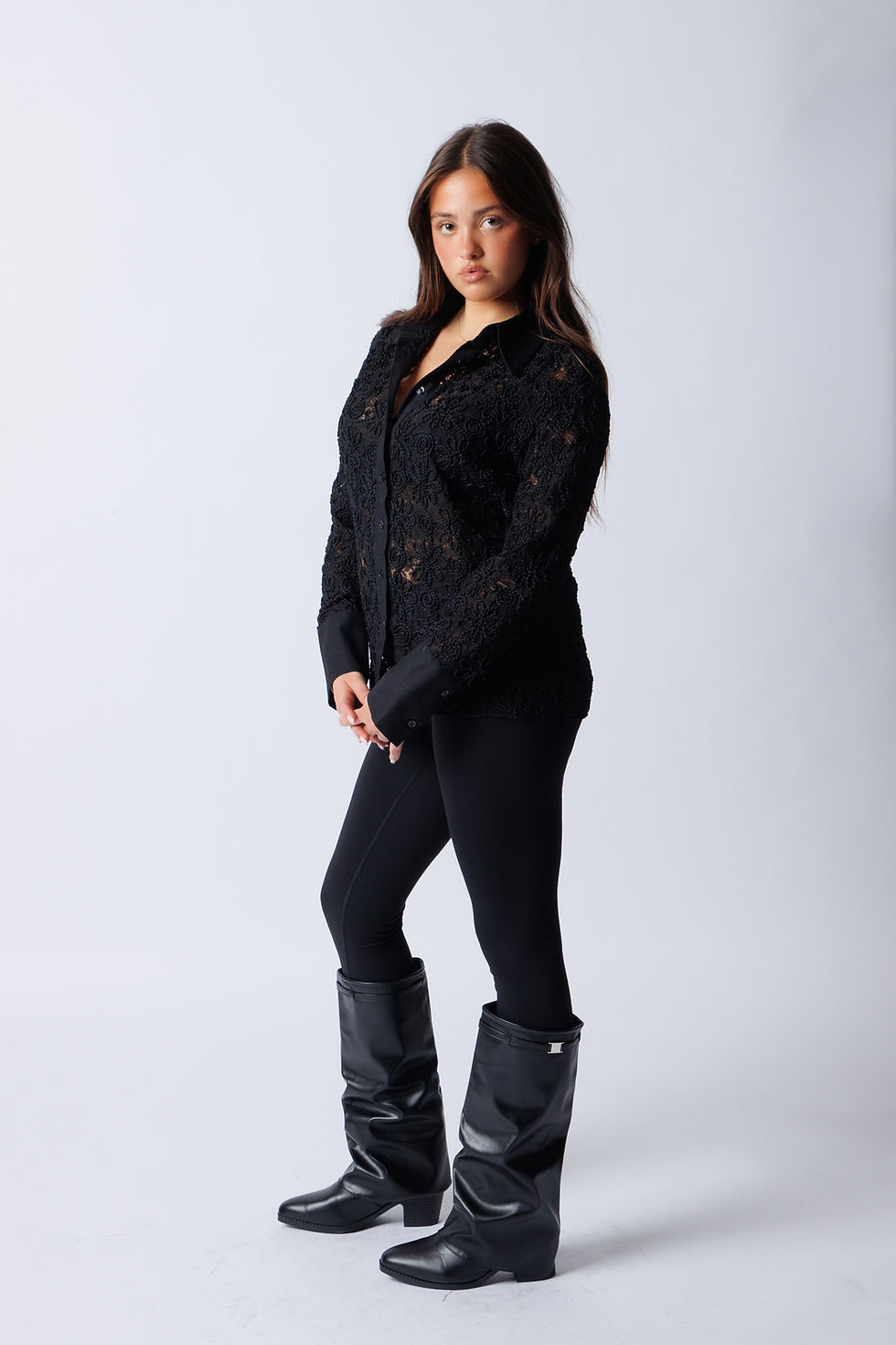 Professional modeling photoshoot in Manhattan featuring a model posing against a studio background