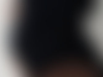 Pregnant woman smiling during same-day maternity photoshoot at NYC studio