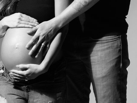 Couple maternity photoshoot in NYC capturing expecting parents at Tals Studio