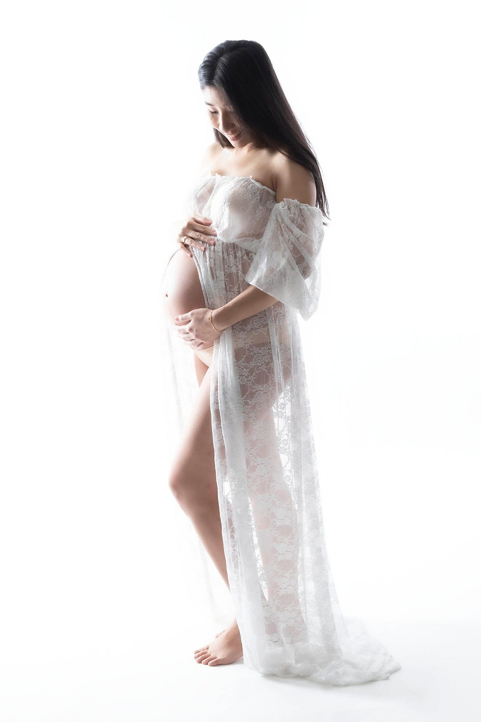 Expecting mother posing with on-site wardrobe during NYC maternity package session