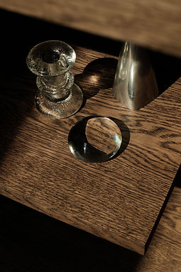 kaboompics_glass-and-silver-decorative-objects-on-a-dark-wood-shelf-43436.jpg