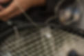 Racket stringing. Detail of tennis racket in the stringing machine.jpg