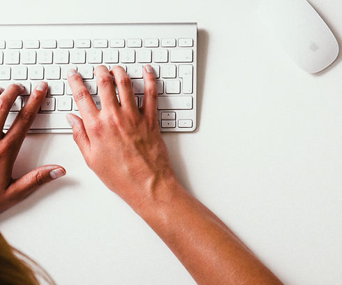 a close up of someone typing on a keyboard