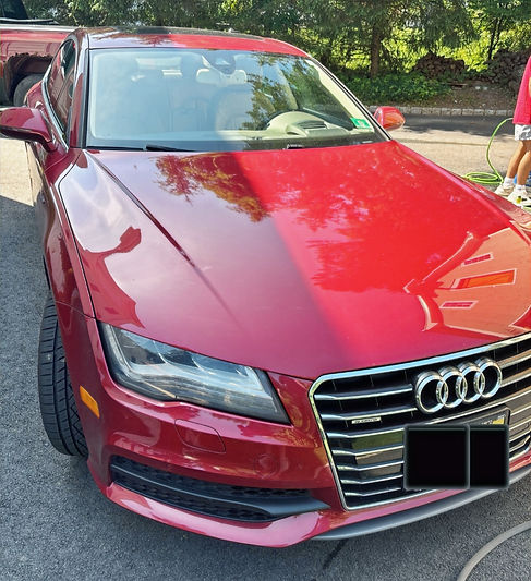 The exterior of an showroom looking Audi following a exterior detail and wax application
