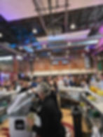 TopShelfTipsy bartenders serving drinks at a large corporate event in the Sixth man center in Philad