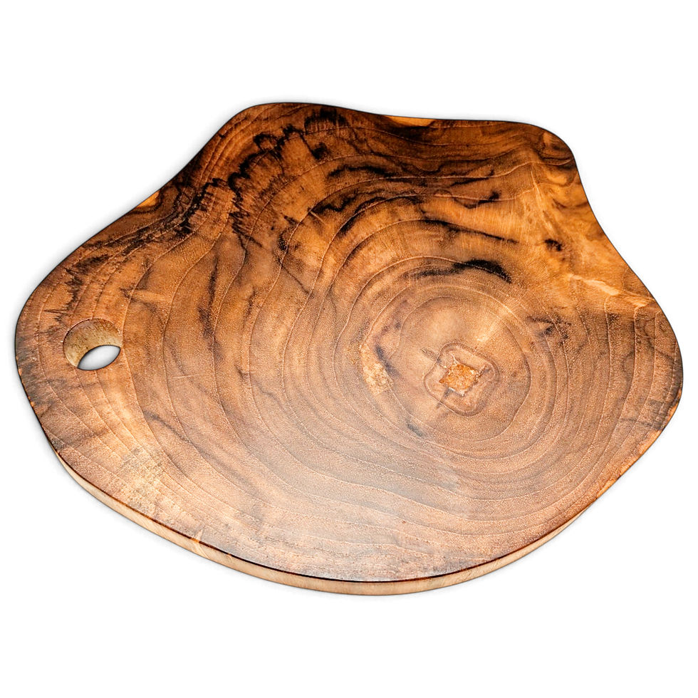 Angled view of a knot-grain teak serving board with an organic outline