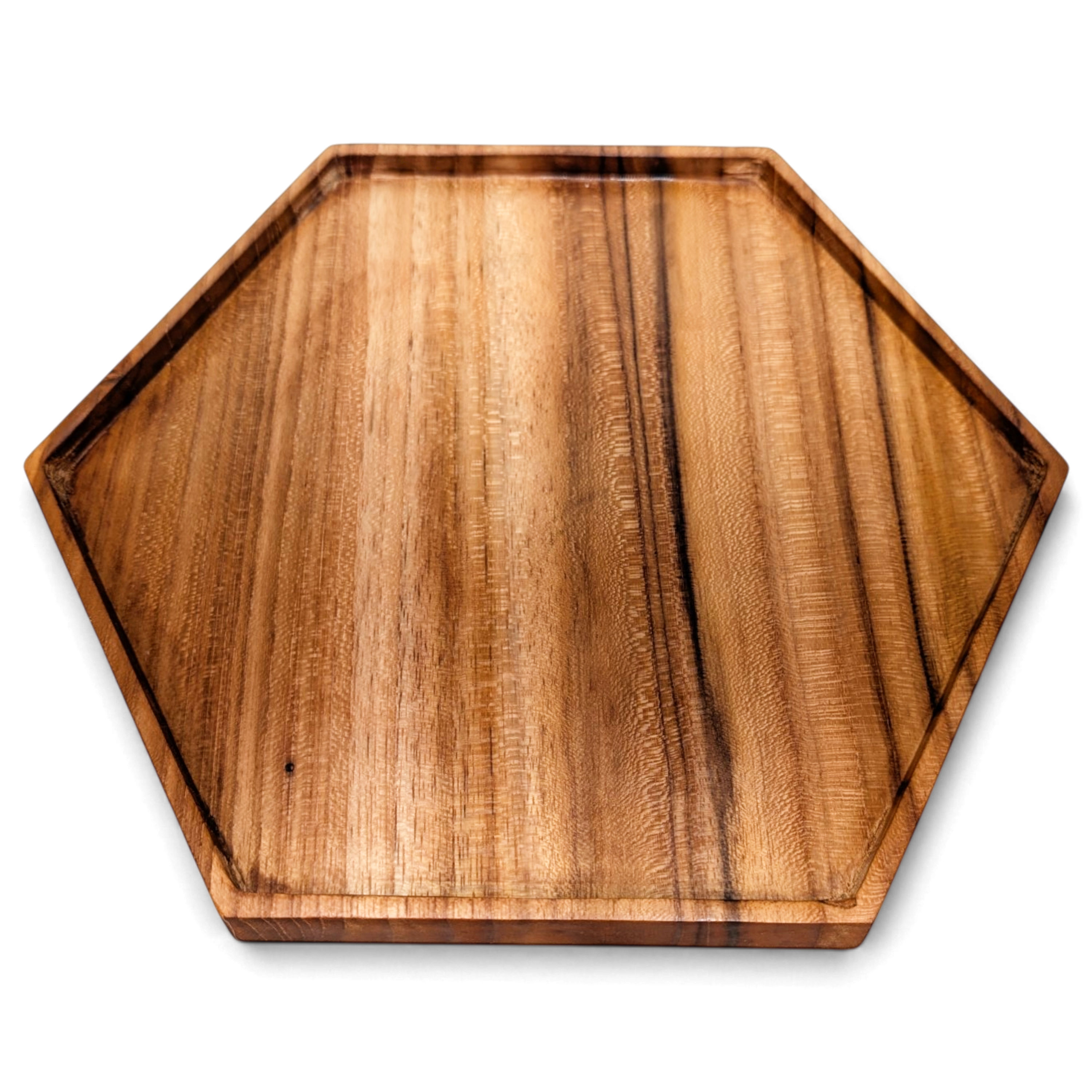 Angled view of a dark-grain hexagon teak plate with a shallow raised rim