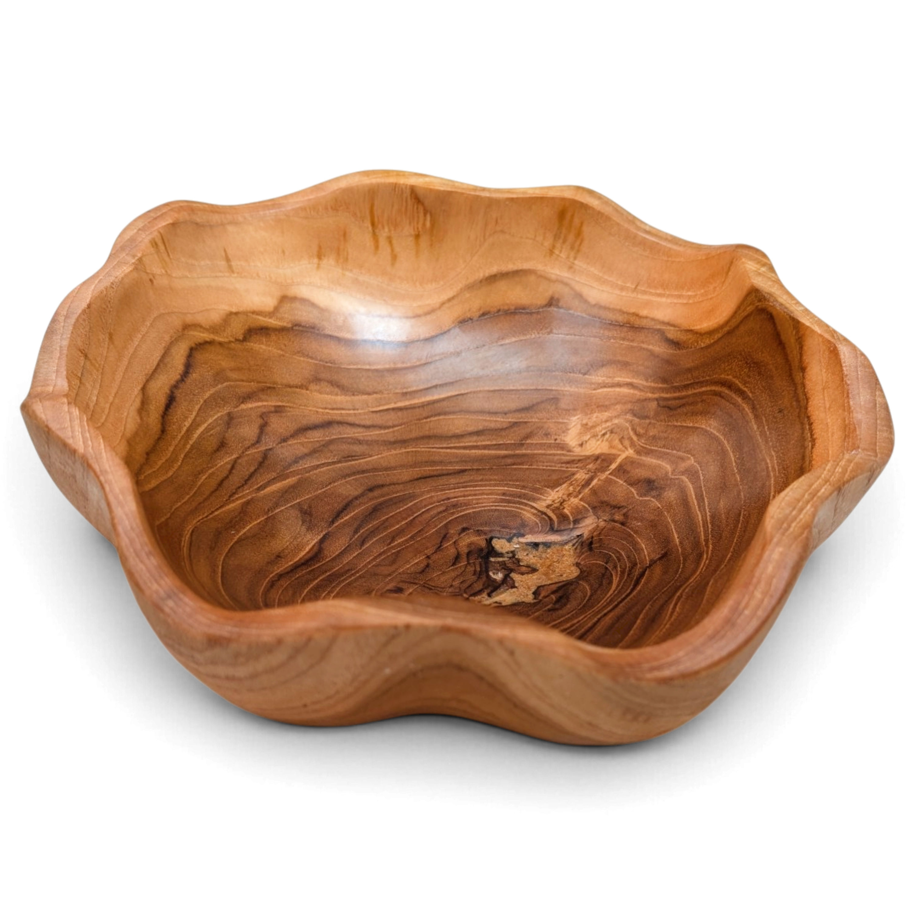 Artisan-made wavy teak centerpiece bowl with natural wood markings