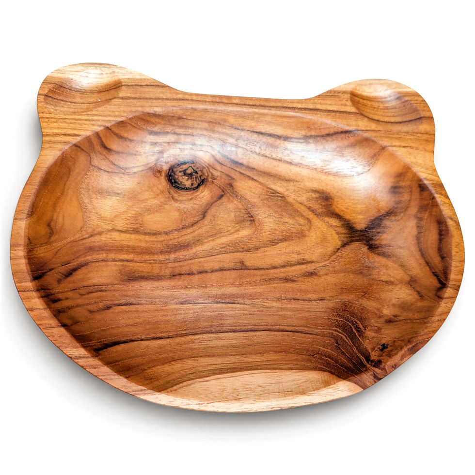 Angled view of a curved teak character plate with three serving sections