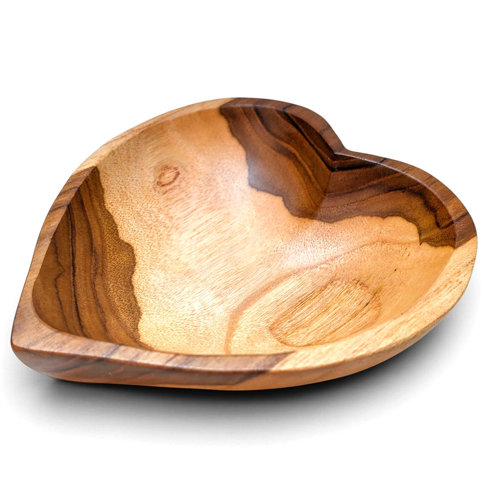 Angled view of a sculptural teak heart serving bowl